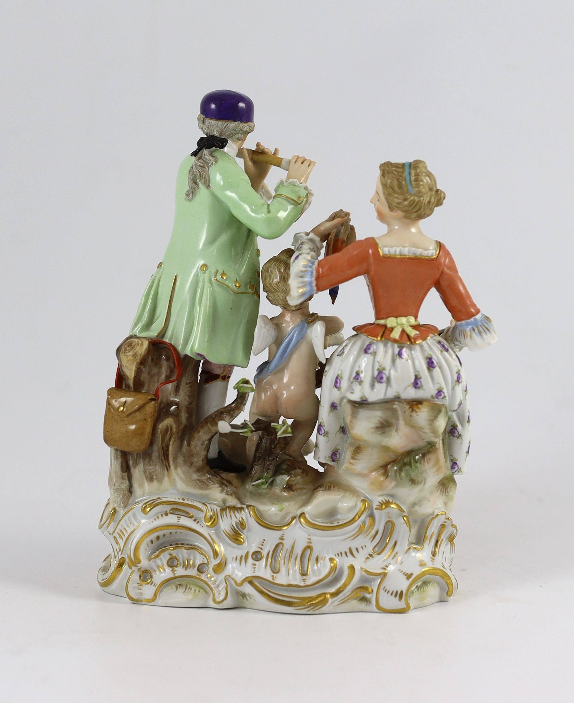 A Meissen Group of a young couple, Cupid and a hare, 19th century, 17 cm high